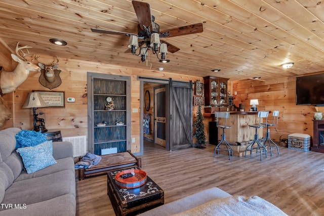 121 Hulse Rd, Jonesborough, TN 37659 - living area featuring ceiling fan, wood ceiling, wood walls, and wood finished floors