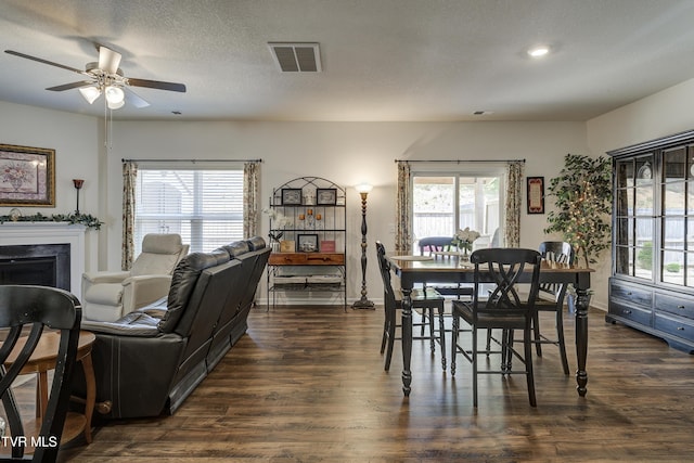 194 Wanderlust Ct, Johnson City, TN 37604 - dining room featuring dark wood finished floors, a ceiling fan, a fireplace, and recessed lighting