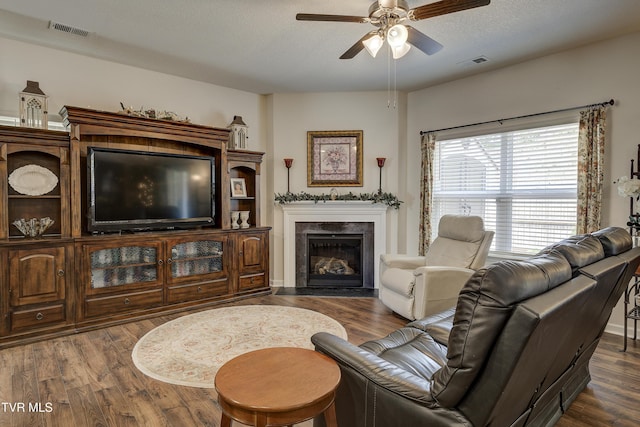 194 Wanderlust Ct, Johnson City, TN 37604 - living area with a ceiling fan, dark wood-style flooring, and a fireplace with flush hearth