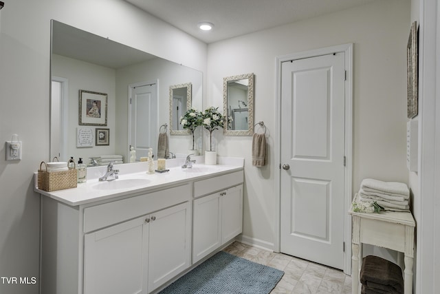 194 Wanderlust Ct, Johnson City, TN 37604 - bathroom with double vanity and baseboards