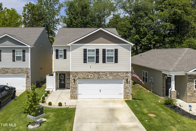 194 Wanderlust Ct, Johnson City, TN 37604 - view of front of home featuring brick siding, concrete driveway, an attached garage, and a front lawn