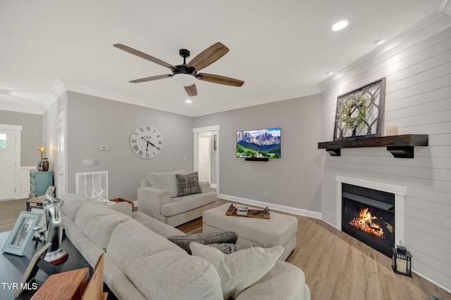 33472 Graceland Ln, Glade Spring, VA 24340 - living area featuring a fireplace, wood finished floors, recessed lighting, ceiling fan, and crown molding