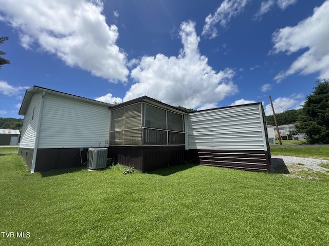 505 NE Lake St, Wise, VA 24293 - back of house with a yard and a sunroom