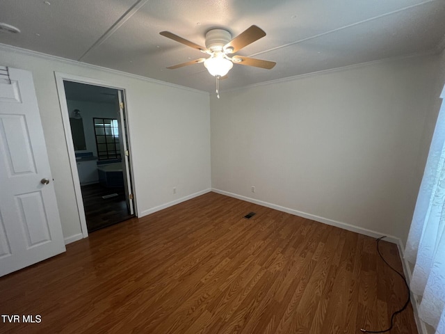 505 NE Lake St, Wise, VA 24293 - unfurnished room with ornamental molding, ceiling fan, and wood finished floors