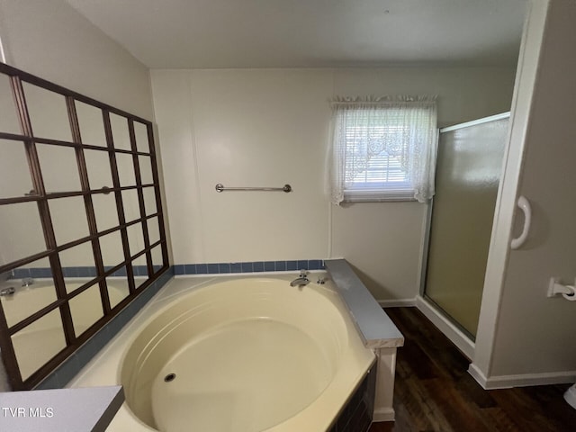 505 NE Lake St, Wise, VA 24293 - full bathroom with a garden tub, a shower stall, and wood finished floors