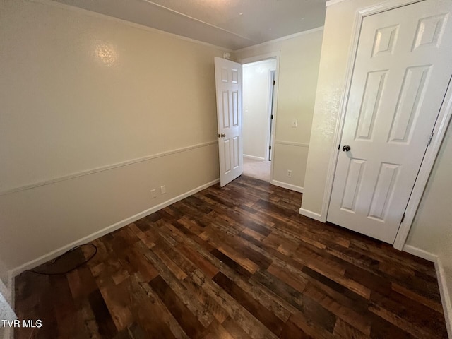 505 NE Lake St, Wise, VA 24293 - unfurnished bedroom with dark wood-type flooring and crown molding