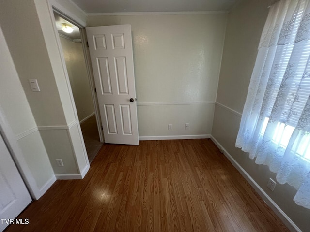 505 NE Lake St, Wise, VA 24293 - unfurnished bedroom featuring wood finished floors and ornamental molding