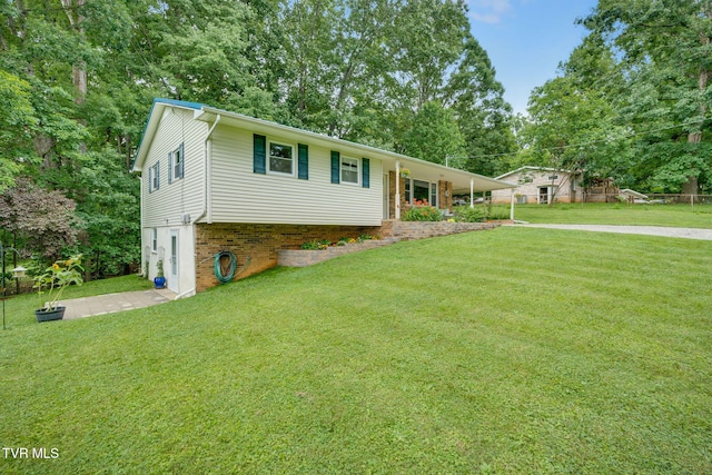 380 Lovelace Loop, Mountain View Loop, Fall Branch, TN 37656 - view of front of property with a front yard, view of scattered trees, and brick siding