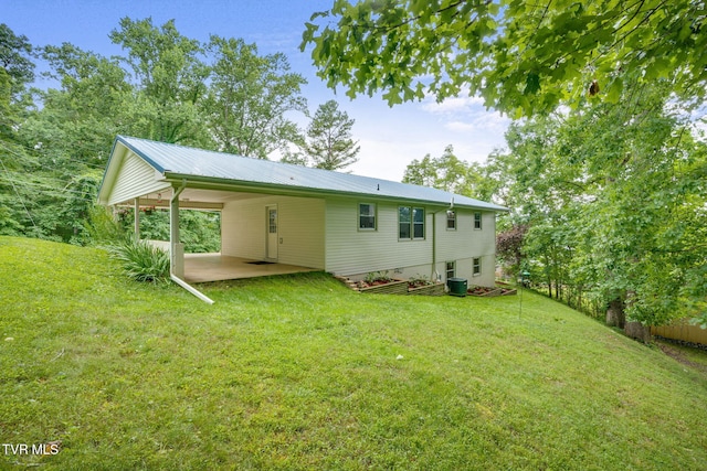 380 Lovelace Loop, Mountain View Loop, Fall Branch, TN 37656 - rear view of property featuring a yard, a carport, a metal roof, and a patio area