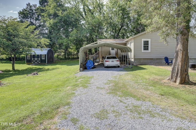 1277 Cooks Valley Rd, Kingsport, TN 37664 - view of grassy yard with a shed, driveway, and a carport