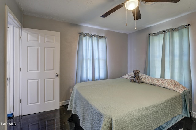 1277 Cooks Valley Rd, Kingsport, TN 37664 - bedroom with dark wood finished floors and ceiling fan