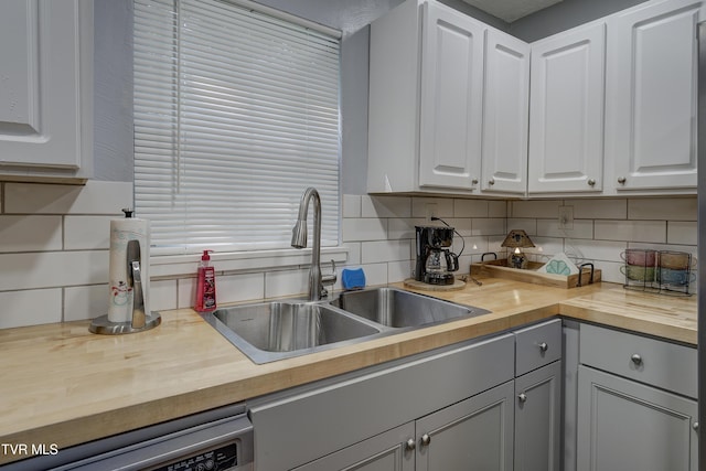 1277 Cooks Valley Rd, Kingsport, TN 37664 - kitchen with butcher block countertops, dishwashing machine, decorative backsplash, white cabinets, and gray cabinetry