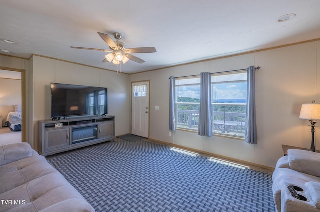 120 Maple Crest Cir, Surgoinsville, TN 37873 - carpeted living area with crown molding and a ceiling fan