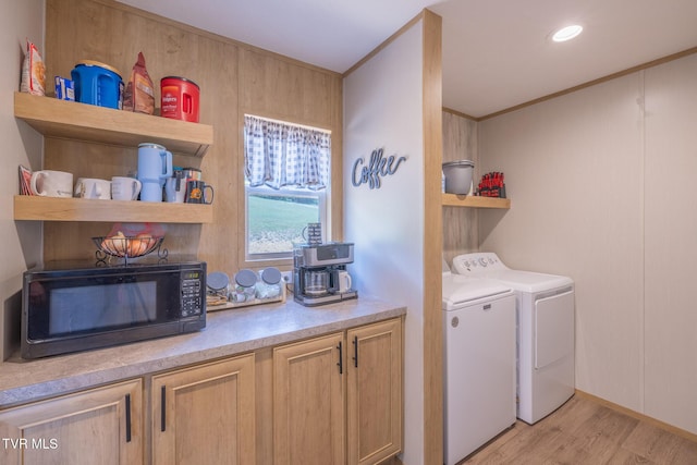 120 Maple Crest Cir, Surgoinsville, TN 37873 - laundry area featuring light wood-style flooring, ornamental molding, and washing machine and clothes dryer