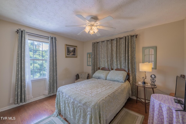 124 Maple Crest Cir, Surgoinsville, TN 37873 - bedroom with wood finished floors, a textured ceiling, and a ceiling fan