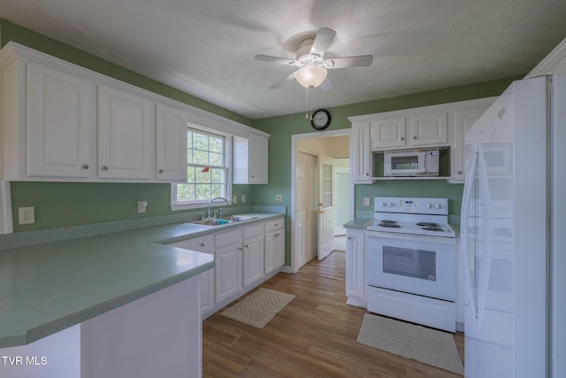 124 Maple Crest Cir, Surgoinsville, TN 37873 - kitchen with white appliances, white cabinetry, dark wood-style floors, a ceiling fan, and a textured ceiling