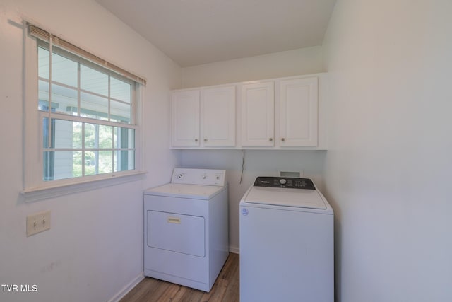 124 Maple Crest Cir, Surgoinsville, TN 37873 - laundry room with cabinet space, washing machine and clothes dryer, and light wood-type flooring
