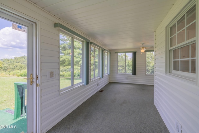 124 Maple Crest Cir, Surgoinsville, TN 37873 - unfurnished sunroom featuring carpet, wood walls, and ceiling fan