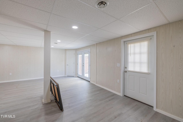 124 Maple Crest Cir, Surgoinsville, TN 37873 - spare room featuring wood finished floors, a paneled ceiling, wood walls, and french doors