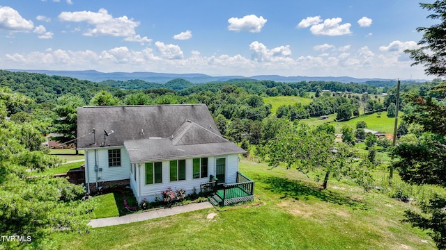 124 Maple Crest Cir, Surgoinsville, TN 37873 - view from above of property featuring a heavily wooded area and a mountainous background