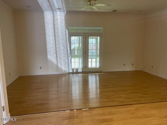 1203 E 8th Ave Unit 3, Johnson City, TN 37601 - unfurnished room featuring wood finished floors, a ceiling fan, and crown molding