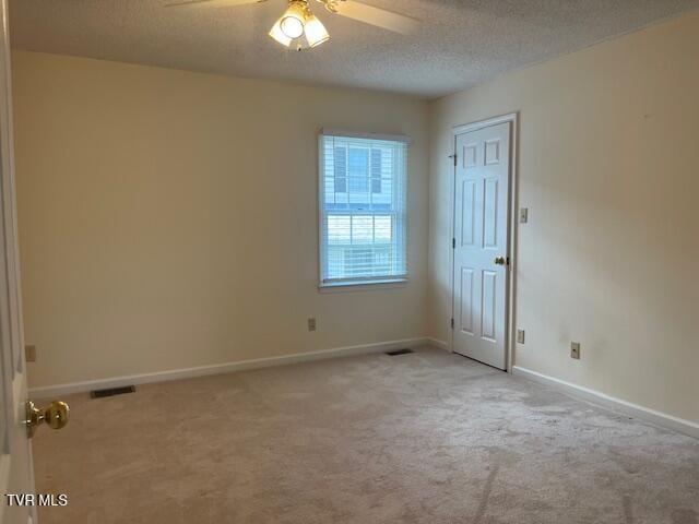 1203 E 8th Ave Unit 3, Johnson City, TN 37601 - carpeted spare room with a ceiling fan and a textured ceiling