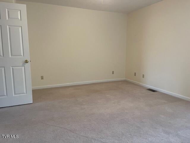 1203 E 8th Ave Unit 3, Johnson City, TN 37601 - carpeted empty room with baseboards