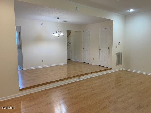 1203 E 8th Ave Unit 3, Johnson City, TN 37601 - unfurnished room with a chandelier, light wood-style floors, and recessed lighting
