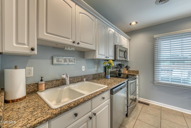 103 Daniels Way, Johnson City, TN 37615 - kitchen featuring appliances with stainless steel finishes, recessed lighting, light tile patterned floors, and white cabinetry