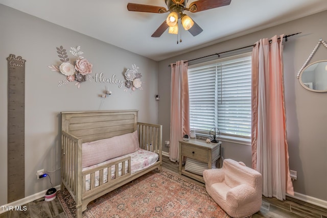 103 Daniels Way, Johnson City, TN 37615 - bedroom featuring a nursery area, wood finished floors, and a ceiling fan