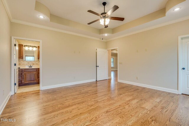 397 Ridgecrest Rd, Jonesborough, TN 37659 - empty room with ceiling fan, light wood-style floors, healthy amount of natural light, a tray ceiling, and crown molding
