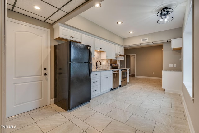 397 Ridgecrest Rd, Jonesborough, TN 37659 - kitchen featuring freestanding refrigerator, stove, white cabinetry, tasteful backsplash, and recessed lighting