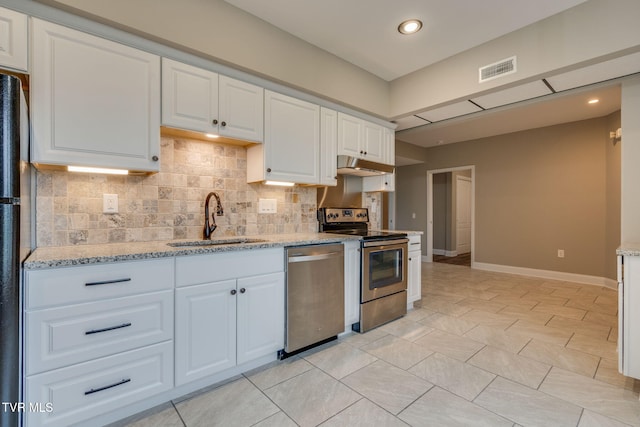 397 Ridgecrest Rd, Jonesborough, TN 37659 - kitchen featuring appliances with stainless steel finishes, under cabinet range hood, white cabinets, backsplash, and light stone counters
