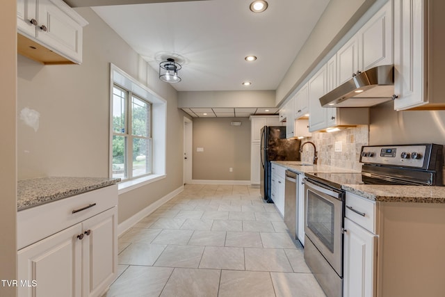 397 Ridgecrest Rd, Jonesborough, TN 37659 - kitchen with appliances with stainless steel finishes, under cabinet range hood, white cabinetry, backsplash, and light stone countertops