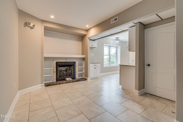 397 Ridgecrest Rd, Jonesborough, TN 37659 - unfurnished living room featuring a fireplace with raised hearth, light tile patterned flooring, and recessed lighting