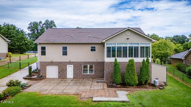 397 Ridgecrest Rd, Jonesborough, TN 37659 - back of house with brick siding, a patio, an attached garage, and a sunroom