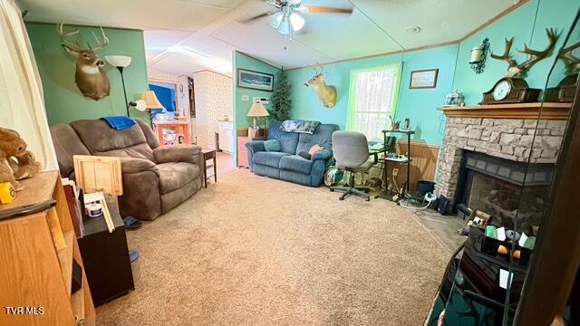 188 Flanary St, Kingsport, TN 37660 - carpeted living room featuring a ceiling fan, lofted ceiling, and a stone fireplace