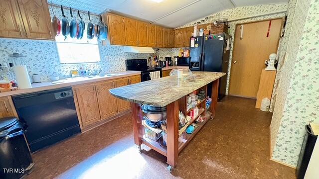 188 Flanary St, Kingsport, TN 37660 - kitchen featuring dishwasher, electric range oven, wallpapered walls, open shelves, and lofted ceiling