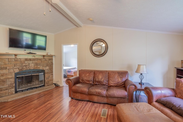 1070 Bill Martin Rd, Afton, TN 37616 - living area with wood finished floors, ornamental molding, a fireplace, and a textured ceiling