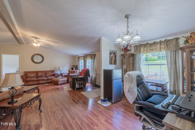 1070 Bill Martin Rd, Afton, TN 37616 - living room with vaulted ceiling, a textured ceiling, plenty of natural light, wood finished floors, and a chandelier