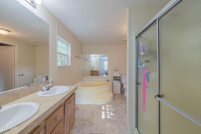 1070 Bill Martin Rd, Afton, TN 37616 - bathroom featuring a garden tub, a stall shower, double vanity, a textured ceiling, and tile patterned floors
