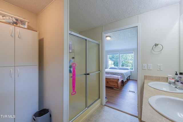 1070 Bill Martin Rd, Afton, TN 37616 - bathroom with a textured ceiling, a shower stall, double vanity, and ensuite bathroom
