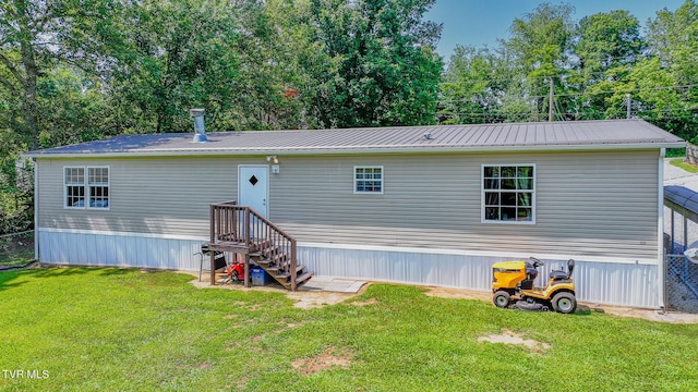 1070 Bill Martin Rd, Afton, TN 37616 - rear view of property featuring a lawn and a metal roof