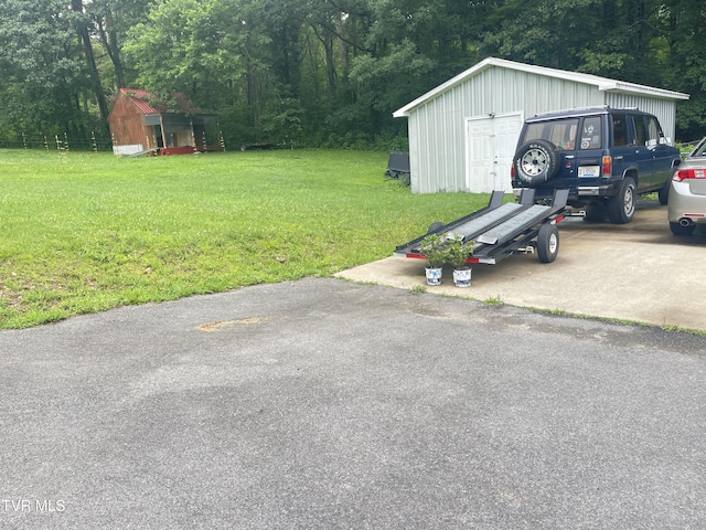 134 Carver Crabtree Rd, Hampton, TN 37658 - view of green lawn featuring a storage shed