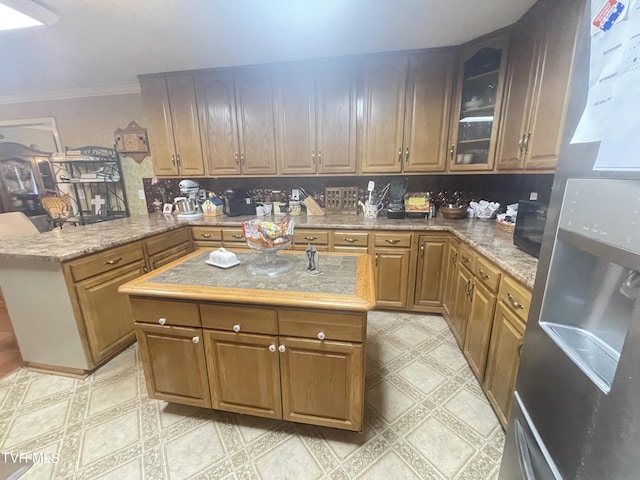 134 Carver Crabtree Rd, Hampton, TN 37658 - kitchen with freestanding refrigerator, light floors, a peninsula, glass insert cabinets, and ornamental molding