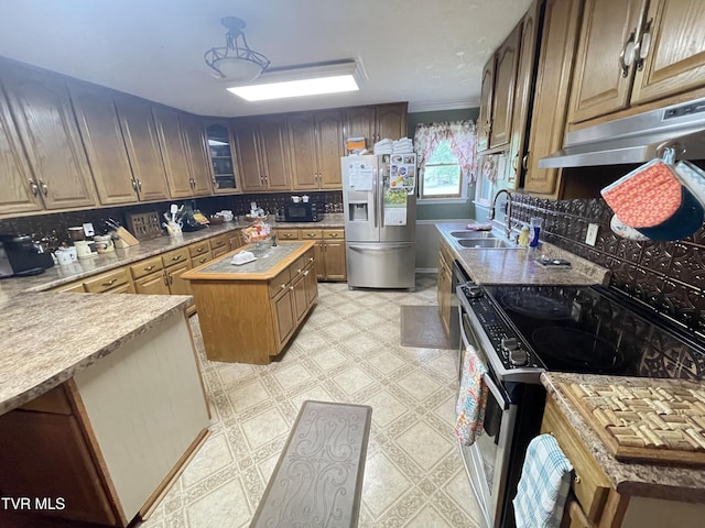 134 Carver Crabtree Rd, Hampton, TN 37658 - kitchen with appliances with stainless steel finishes, under cabinet range hood, tasteful backsplash, and light flooring