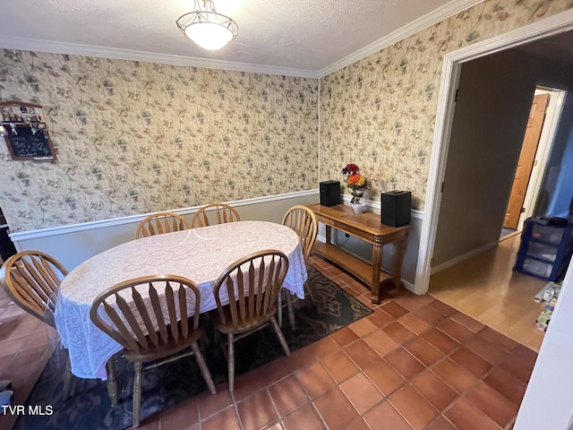 134 Carver Crabtree Rd, Hampton, TN 37658 - dining room with wainscoting, ornamental molding, a textured ceiling, wallpapered walls, and tile patterned flooring