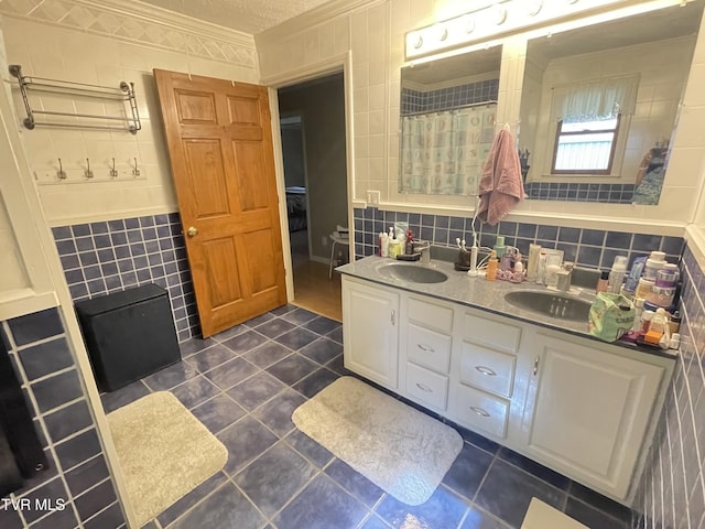 134 Carver Crabtree Rd, Hampton, TN 37658 - bathroom with ornamental molding, tile walls, tile patterned flooring, and double vanity