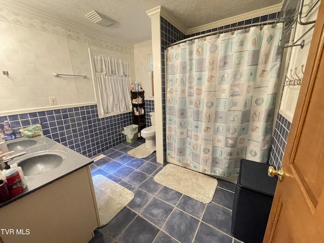 134 Carver Crabtree Rd, Hampton, TN 37658 - bathroom with tile walls, tile patterned flooring, a textured ceiling, ornamental molding, and double vanity