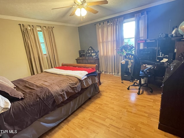 134 Carver Crabtree Rd, Hampton, TN 37658 - bedroom with wood finished floors, crown molding, a textured ceiling, and a ceiling fan